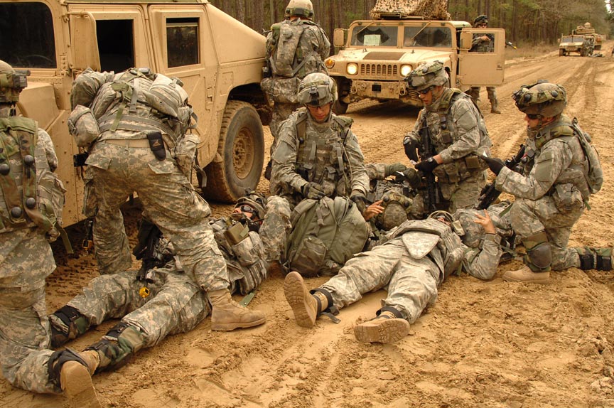 U.S. Army scouts from Headquarters and Headquarters Company, 1st Battalion, 30th Infantry Regiment, 3rd Infantry Division treat simulated injured Soldiers after their humvee was hit by a mock roadside bomb during a mission readiness exercise on Fort Stewart, Ga., March 3, 2007. (U.S. Army photo by Spc. Shawn Cassatt) (Released)
