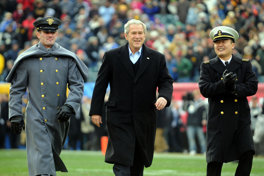 081206-N-5549O-002 PHILADELPHIA (Nov. 6, 2008) President George W. Bush is escorted onto the field by a U.S. Military Academy cadet and a U.S. Naval Academy midshipman before the start of the 109th Army-Navy college football game at Lincoln Financial Field in Philadelphia. (U.S. Navy photo by Mass Communication Specialist 2nd Class Kevin S. O'Brien/Released)(U.S. Navy photo by Mass Communication Specialist 2nd Class Kevin S. O'Brien/Released)